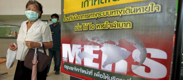A woman wearing a mask walks past an information banner on Middle East Respiratory Syndrome (MERS) at the entrance of Bamrasnaradura Infectious Diseases Institute at a hospital in Nonthaburi province, on the outskirts of Bangkok, Thailand, June 19, 2015 A woman wearing a mask walks past an information banner on Middle East Respiratory Syndrome (MERS) at the entrance of Bamrasnaradura Infectious Diseases Institute at a hospital in Nonthaburi province, on the outskirts of Bangkok, Thailand, June 19, 2015 - Sputnik International