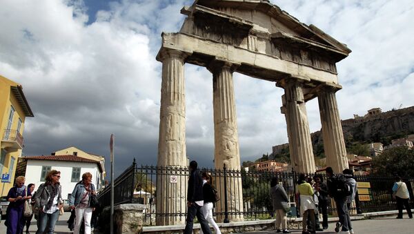 Tourists  walk outside the gate of the ancient Roman agora in Athens, Greece - Sputnik International