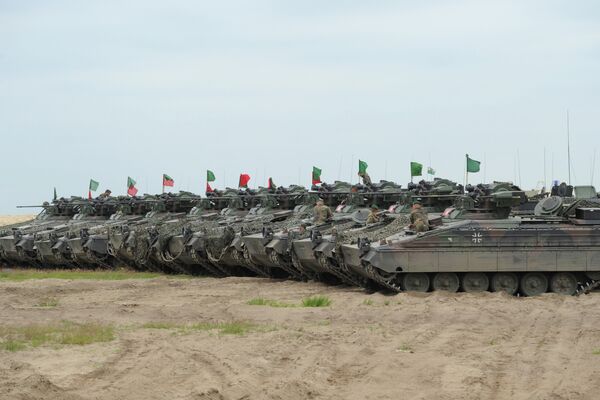 German army tanks are lined up after the NATO Noble Jump exercise on a training range near Swietoszow Zagan, Poland, Thursday, June 18, 2015 - Sputnik International