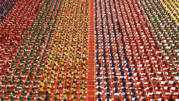 Students practice yoga in the lawns of their school ahead of International Day of Yoga, in Chennai, India, June 19, 2015 - Sputnik International