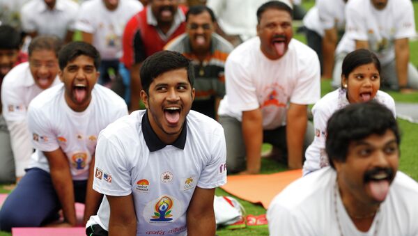 Indians perform yoga at an event to celebrate the International Yoga Day - Sputnik International