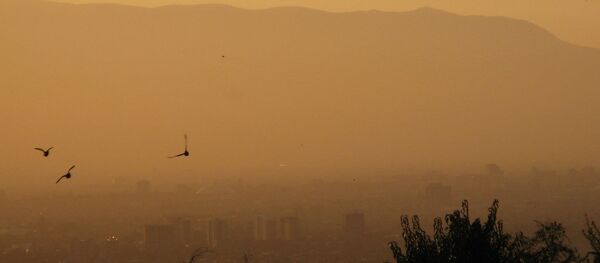 A smoggy Santiago sunset. A smoggy Santiago sunset. - Sputnik International