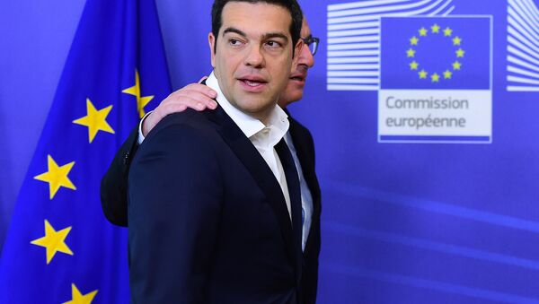 Greece's Prime Minister Alexis Tsipras (L) is welcomed by European Commission President Jean-Claude Juncker ahead of an emergency summit with the leaders of Athens' creditors at the European Commission in Brussels, on June 22, 2015. - Sputnik International