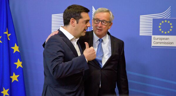 Greek Prime Minister Alexis Tsipras, left, speaks with European Commission President Jean-Claude Juncker as he arrives for a meeting prior to an EU summit at EU headquarters in Brussels Greek Prime Minister Alexis Tsipras, left, speaks with European Commission President Jean-Claude Juncker as he arrives for a meeting prior to an EU summit at EU headquarters in Brussels - Sputnik International