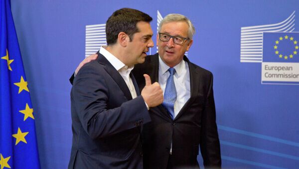 Greek Prime Minister Alexis Tsipras, left, speaks with European Commission President Jean-Claude Juncker as he arrives for a meeting prior to an EU summit at EU headquarters in Brussels - Sputnik International