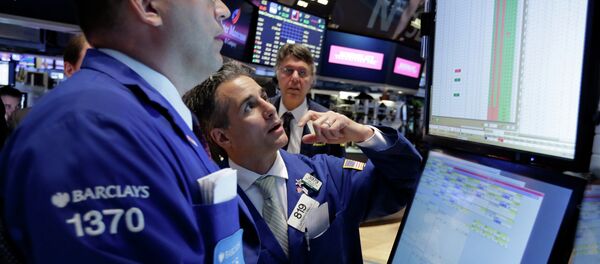 Specialists Anthony Matesic, left, and Anthony Rinaldi, center, work on the floor of the New York Stock Exchange Wednesday, June 17, 2015 Specialists Anthony Matesic, left, and Anthony Rinaldi, center, work on the floor of the New York Stock Exchange Wednesday, June 17, 2015 - Sputnik International