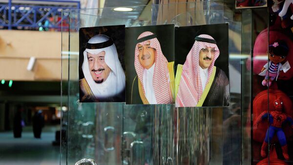 In this April 16, 2015 file photo, images of Saudi King Salman, left, then Crown Prince Muqrin, center, and then Deputy Crown Prince Mohammed bin Nayef are displayed on a shop door at the al Aqeeliya market in Riyadh, Saudi Arabia. - Sputnik International