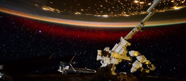 Stationed aboard the International Space Station, US Astronaut Scott Kelly has captured eerie and beautiful photo and video materials of a rare red aurora from 400km above Earth's atmosphere. Stationed aboard the International Space Station, US Astronaut Scott Kelly has captured eerie and beautiful photo and video materials of a rare red aurora from 400km above Earth's atmosphere. - Sputnik International