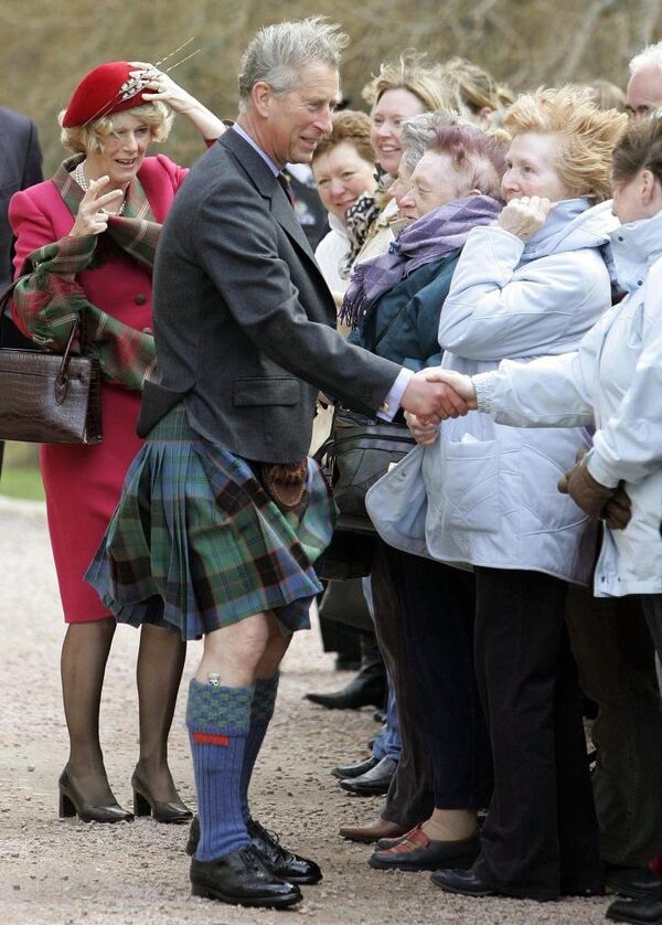 Prince Charles and his wife Camilla meet well-wishers at Crathie Parish Church in Aberdeenshire 10 April 2005 in their first public engagement since becoming husband and wife. Prince Charles, known as the Duke of Rothesay when in Scotland and Camilla, Duchess of Cornwall were greeted with a round of applause by the hundred or so onlookers on their arrival at the church. - Sputnik International