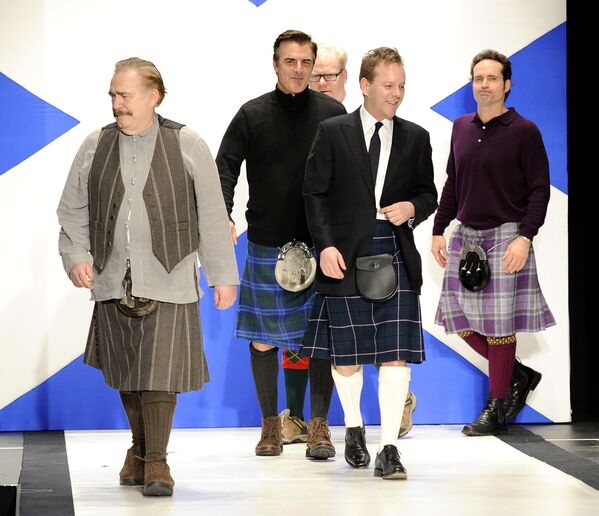 Actors, from left, Brian Cox, Chris Noth, Kiefer Sutherland, Jim Gaffigan, Jason Patric walk the runway at the 'Dressed To Kilt' fashion show to benefit the Friends of Scotland Organization at the Hammerstein Ballroom in April 2011 in New York. - Sputnik International
