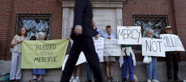 A pedestrian walks past death penalty protesters before the formal sentencing of convicted Boston Marathon bomber Dzhokhar Tsarnaev at the federal courthouse in Boston, Massachusetts June 24, 2015 A pedestrian walks past death penalty protesters before the formal sentencing of convicted Boston Marathon bomber Dzhokhar Tsarnaev at the federal courthouse in Boston, Massachusetts June 24, 2015 - Sputnik International