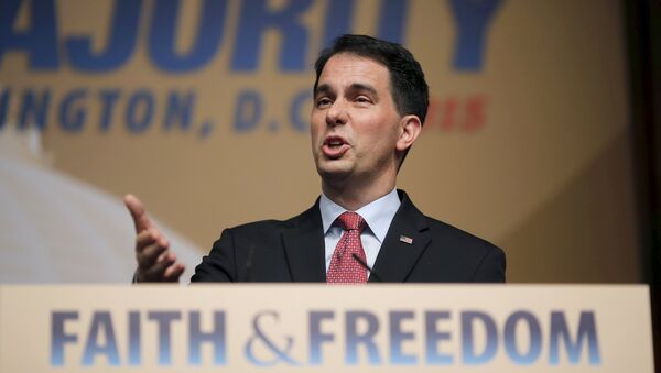 Wisconsin Governor and Republican presidential candidate Scott Walker addresses supporters during a dinner at the Road to Majority conference in Washington June 20, 2015 - Sputnik International
