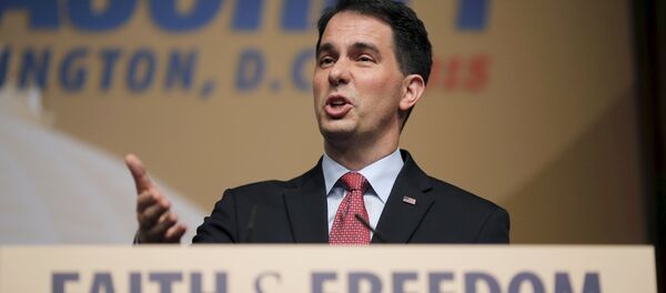 Wisconsin Governor and Republican presidential candidate Scott Walker addresses supporters during a dinner at the Road to Majority conference in Washington June 20, 2015 - Sputnik International