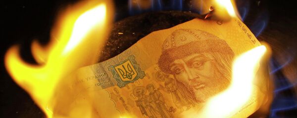 A burning one hryvnia bill - Sputnik International