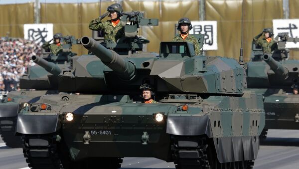 Members of the Japan Ground Self-Defense Force salute from Type 90 tanks at a parade during the Self-Defense Forces Day at Asaka Base, north of Tokyo (File) - Sputnik International
