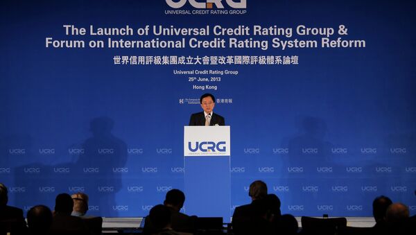 Guan Jianzhong, chairman of the Universal Credit Rating Group, delivers his speech at the launch ceremony in Hong Kong Tuesday, June 25, 2013 - Sputnik International