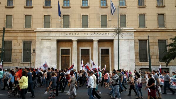 Members of the Communist-affiliated PAME labor union pass in front of the Bank of Greece during an anti-austerity protest in Athens on Tuesday, June 23, 2015 - Sputnik International