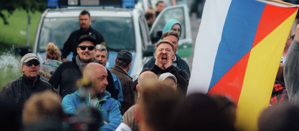 In this June 24, 2016 protestors demonstrate against the accommodation of migrants in Freital near Dresden, eastern Germany In this June 24, 2016 protestors demonstrate against the accommodation of migrants in Freital near Dresden, eastern Germany - Sputnik International