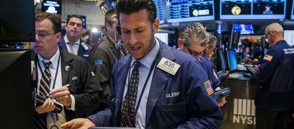 A trader works on the floor of the New York Stock Exchange shortly after the opening bell in New York, June 24, 2015 A trader works on the floor of the New York Stock Exchange shortly after the opening bell in New York, June 24, 2015 - Sputnik International