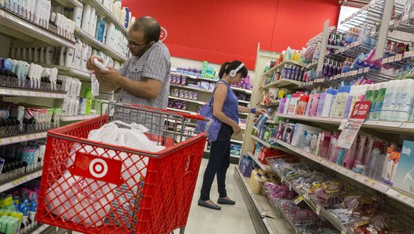 Customers shop in the pharmacy department of a Target store in New York, in this file photo taken June 15, 2015 - Sputnik International
