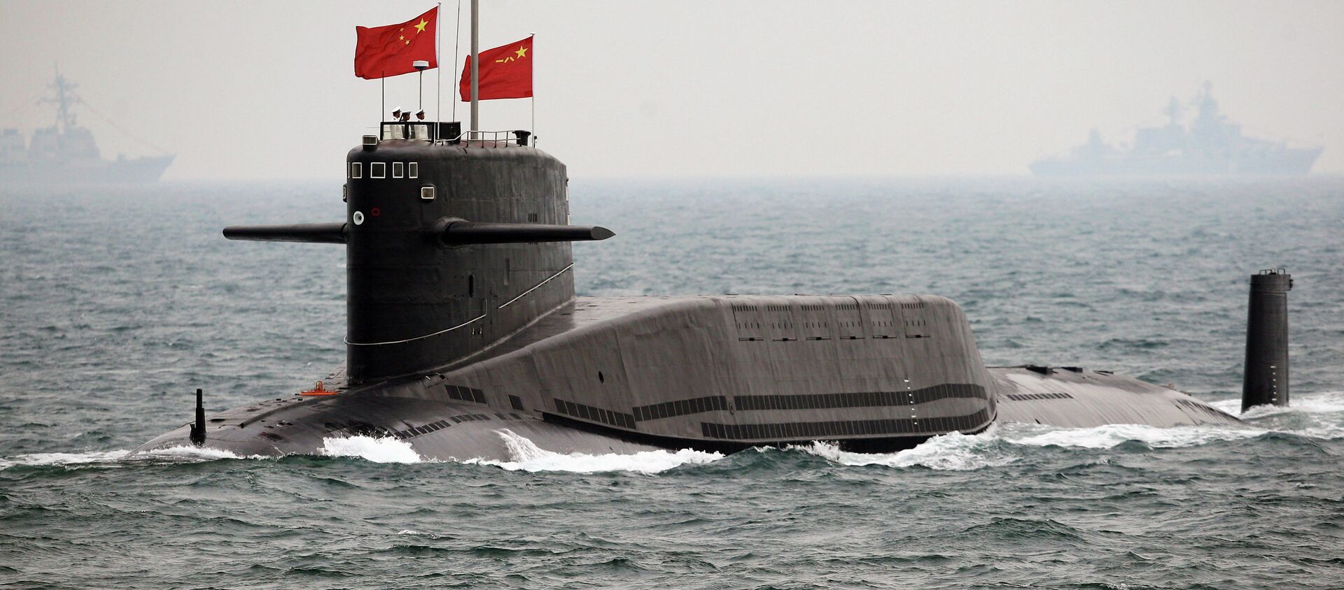 File photo, a Chinese Navy nuclear-powered submarine sails during an international fleet review to celebrate the 60th anniversary of the founding of People's Liberation Army Navy - Sputnik International, 1920, 01.08.2019