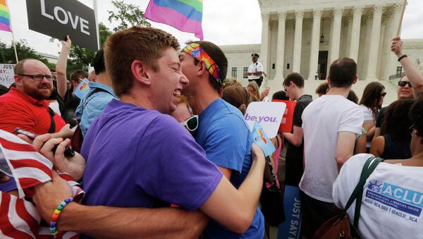 Gay rights supporters celebrate after the U.S. Supreme Court ruled that the U.S. Constitution provides same-sex couples the right to marry, outside the Supreme Court building in Washington, June 26, 2015 - Sputnik International