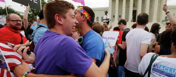 Gay rights supporters celebrate after the U.S. Supreme Court ruled that the U.S. Constitution provides same-sex couples the right to marry, outside the Supreme Court building in Washington, June 26, 2015 Gay rights supporters celebrate after the U.S. Supreme Court ruled that the U.S. Constitution provides same-sex couples the right to marry, outside the Supreme Court building in Washington, June 26, 2015 - Sputnik International
