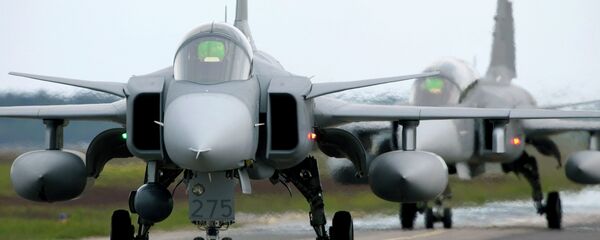 Saab JAS 39 Gripen (Griffin) fighter aircraft taxi out for start during the NATO exercise Loyal Arrow outside Lulea in northern Sweden, on June 10, 2009 - Sputnik International