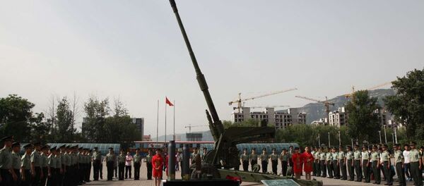 The 127th Ordinance Institute, of the Central Northern University, China, handed over a new 125mm cannon to People's Liberation Army officers at a June 10, 2015 ceremony. The 127th Ordinance Institute, of the Central Northern University, China, handed over a new 125mm cannon to People's Liberation Army officers at a June 10, 2015 ceremony. - Sputnik International