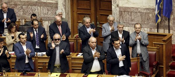 Greek Prime Minister Alexis Tsipras (bottom R) acknowledges applause during a parliamentary session in Athens, Greece June 28, 2015 Greek Prime Minister Alexis Tsipras (bottom R) acknowledges applause during a parliamentary session in Athens, Greece June 28, 2015 - Sputnik International