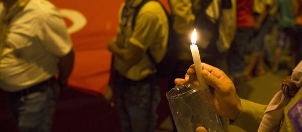 A boy scout holds a candle - Sputnik International