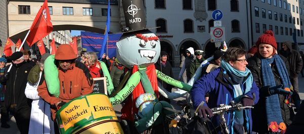 Participants of a rally against NATO's policy by Munich's Rathaus (Town Hall) Participants of a rally against NATO's policy by Munich's Rathaus (Town Hall) - Sputnik International