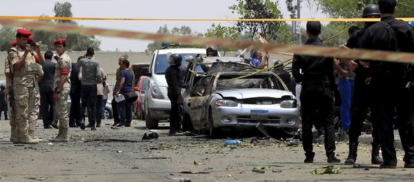 Policemen and army forces are seen at the site of a car bomb attack on the convoy of Egyptian public prosecutor Hisham Barakat near his house at Heliopolis district in Cairo, Egypt Policemen and army forces are seen at the site of a car bomb attack on the convoy of Egyptian public prosecutor Hisham Barakat near his house at Heliopolis district in Cairo, Egypt - Sputnik International