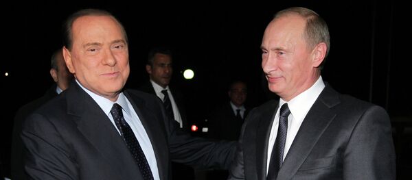 Russian Prime Minister Vladimir Putin (right) meets his Italian counterpart Silvio Berlusconi (left), 2010 Russian Prime Minister Vladimir Putin (right) meets his Italian counterpart Silvio Berlusconi (left), 2010 - Sputnik International