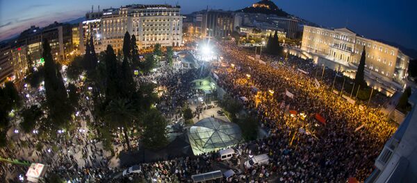 Protesters attend an anti-austerity rally in front of the parliament building in Athens, Greece, June 29, 2015 Protesters attend an anti-austerity rally in front of the parliament building in Athens, Greece, June 29, 2015 - Sputnik International