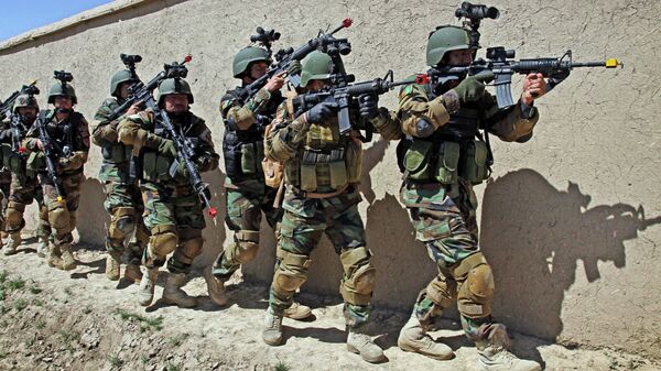 In this Thursday, April 12, 2012 file photo, Afghan special forces demonstrate a raid for rescuing a hostage during a showing at the commando training center in Kabul, Afghanistan. - Sputnik International