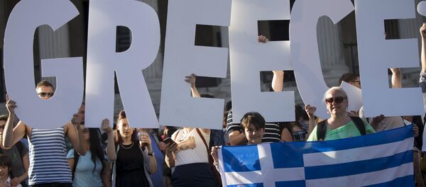 Demonstrators gather to protest against the European Central Bank's handling of Greece's debt repayments in Trafalgar Square in London, Britain June 29, 2015 Demonstrators gather to protest against the European Central Bank's handling of Greece's debt repayments in Trafalgar Square in London, Britain June 29, 2015 - Sputnik International
