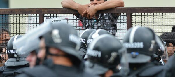 Policemen stand at the entrance of the Debrecen refugee camp in Debrecen, 230 kms from Budapest, Hungary, Monday, June 29, 2015. Police say they used tear gas to stop hundreds of refugees involved in a fight at a refugee camp in this eastern Hungarian city. Policemen stand at the entrance of the Debrecen refugee camp in Debrecen, 230 kms from Budapest, Hungary, Monday, June 29, 2015. Police say they used tear gas to stop hundreds of refugees involved in a fight at a refugee camp in this eastern Hungarian city. - Sputnik International