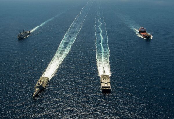 THE USNS Millinocket conducts a training exercise alongside a littoral combat ship, an amphibious transport ship, and a mobile landing platform. - Sputnik International