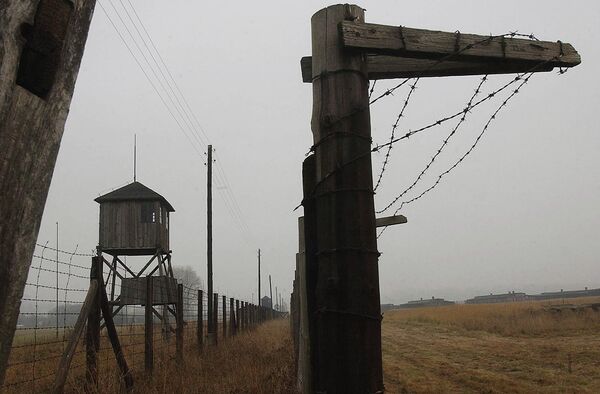 Watch towers and a barbed wire fence of the former Nazi death camp Majdanek outside the city of Lublin in eastern Poland on Wednesday Nov. 9, 2005 Watch towers and a barbed wire fence of the former Nazi death camp Majdanek outside the city of Lublin in eastern Poland on Wednesday Nov. 9, 2005 - Sputnik International