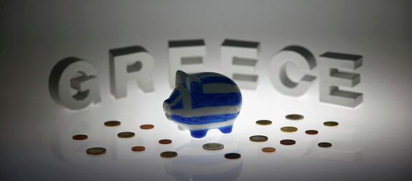A piggybank painted in the colours of the Greek flag stands amongst various euro coins in front of letters spelling the word 'GREECE' in this picture illustration taken in Berlin, Germany June 30, 2015 A piggybank painted in the colours of the Greek flag stands amongst various euro coins in front of letters spelling the word 'GREECE' in this picture illustration taken in Berlin, Germany June 30, 2015 - Sputnik International