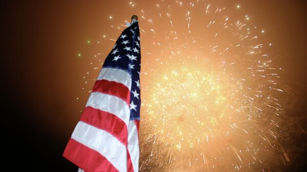 Fireworks behind an American Flag - Sputnik International