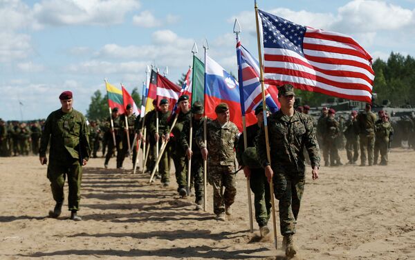 Soldiers from NATO countries attend an opening ceremony of military exercise 'Saber Strike 2015'. - Sputnik International