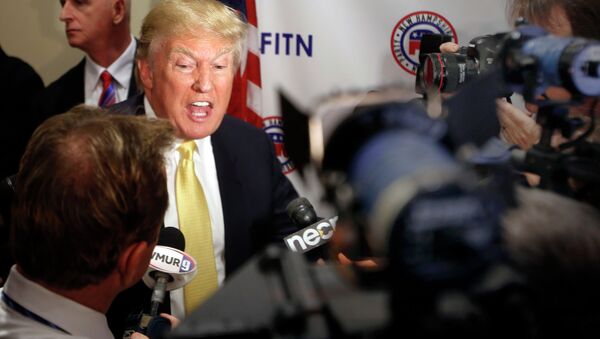 Donald Trump speaks to reporters after addressing at the Republican Leadership Summit Saturday, April 18, 2015, in Nashua, N.H. - Sputnik International