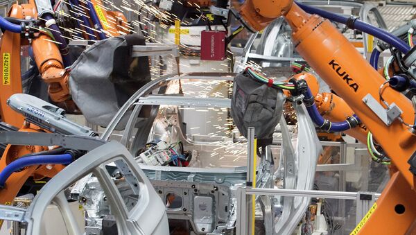 Robots weld a car body at the plant of the German car manufacturer Volkswagen Sachsen in Germany, Monday, Jan. 26, 2015 - Sputnik International