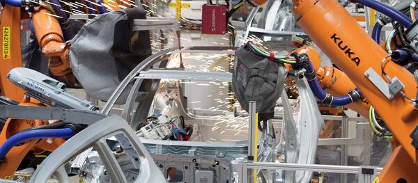 Robots weld a car body at the plant of the German car manufacturer Volkswagen Sachsen in Germany, Monday, Jan. 26, 2015 - Sputnik International