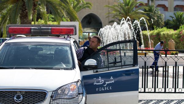 A Tunisian police car patrols in front of the Riu Imperial Marhaba Hotel in Port el Kantaoui, on the outskirts of Sousse south of the capital Tunis, on June 27, 2015 - Sputnik International