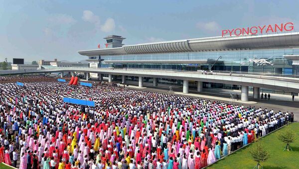 People attend the opening ceremony for the newly built terminal of Pyongyang International Airport in this undated picture released by North Korea's Korean Central News Agency (KCNA) on July 1, 2015 - Sputnik International