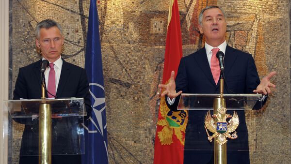 Montenegro's Prime Minister Milo Djukanovic, right, speaks and gestures after talks with NATO Secretary-General Jens Stoltenberg, in Podgorica, Montenegro, Thursday, June 11, 2015 - Sputnik International