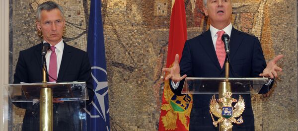 Montenegro's Prime Minister Milo Djukanovic, right, speaks and gestures after talks with NATO Secretary-General Jens Stoltenberg, in Podgorica, Montenegro, Thursday, June 11, 2015 Montenegro's Prime Minister Milo Djukanovic, right, speaks and gestures after talks with NATO Secretary-General Jens Stoltenberg, in Podgorica, Montenegro, Thursday, June 11, 2015 - Sputnik International